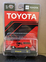 M2 Machines 1:64 1985 Toyota Truck with Camper Shell – Red- Hobby Exclusive